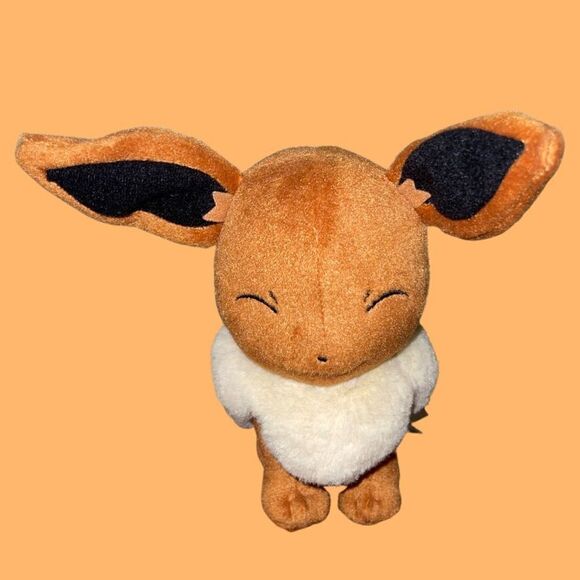 Pokemon Tomy Pokemon Smirking Eevee Goodnight 7" Stuffed Animal - Picture 1 of 4